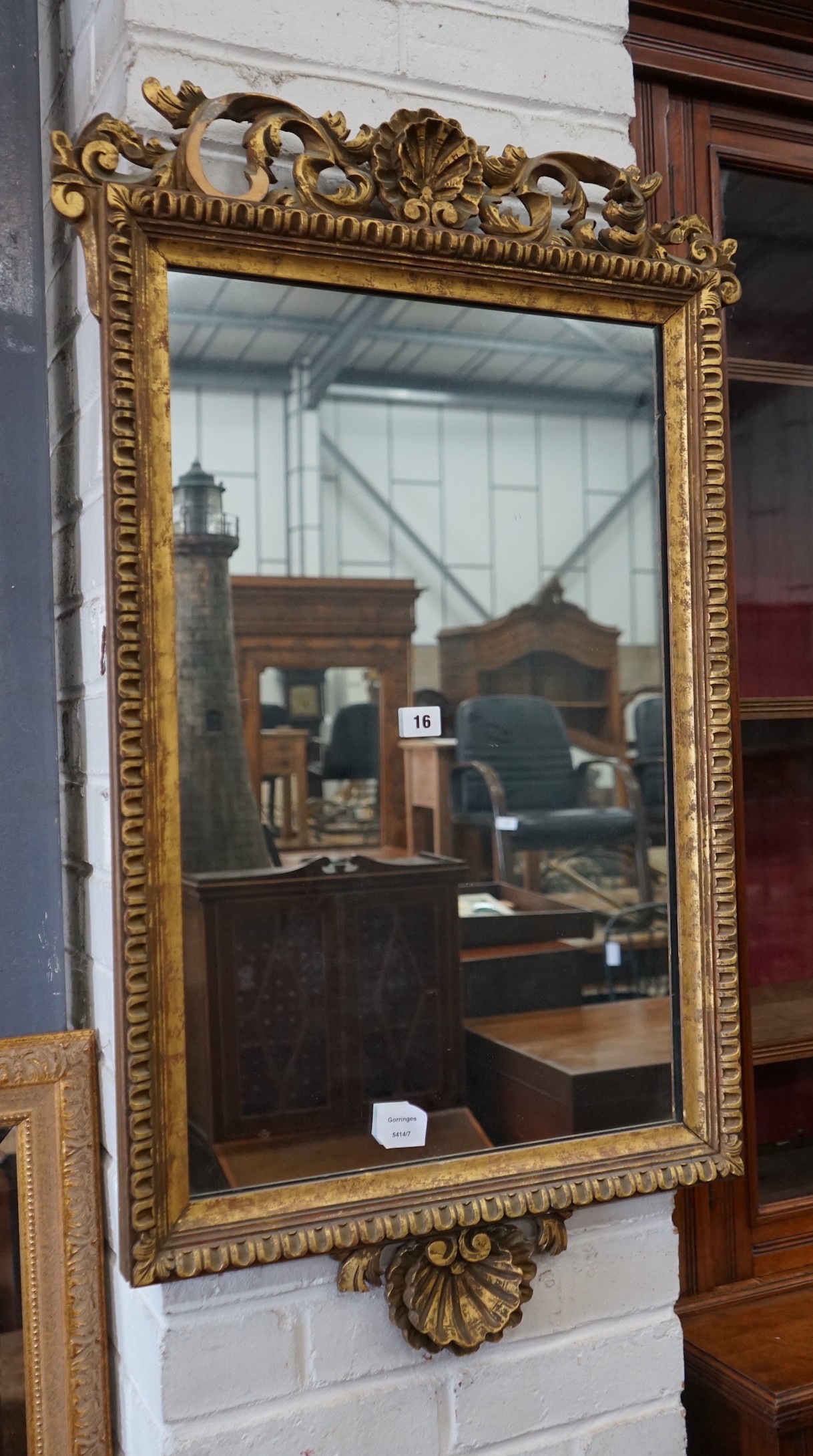 An 18th century style giltwood wall mirror, width 57cm, height 94cm